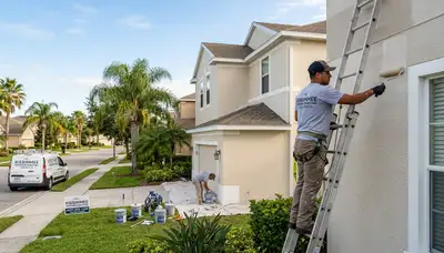 Professional house painters working on residential exterior in Orlando FL