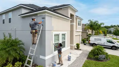Professional house painters transforming home exterior in Orlando, FL